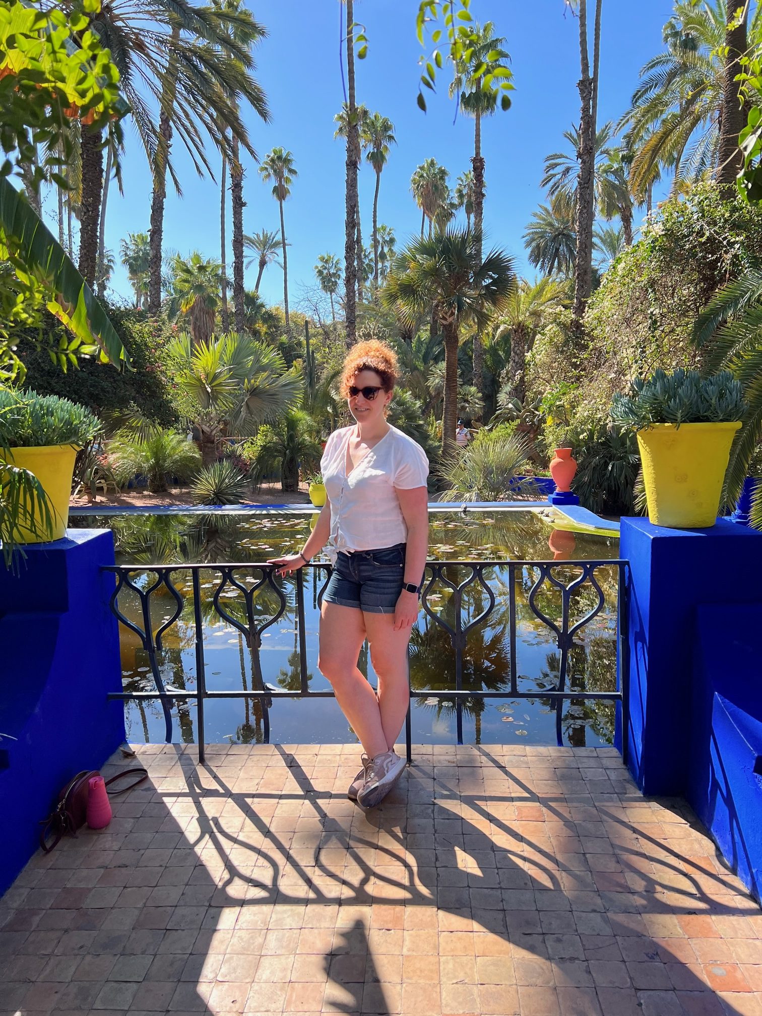 Becky Hughes standing in front of a pool of water in Marrakech