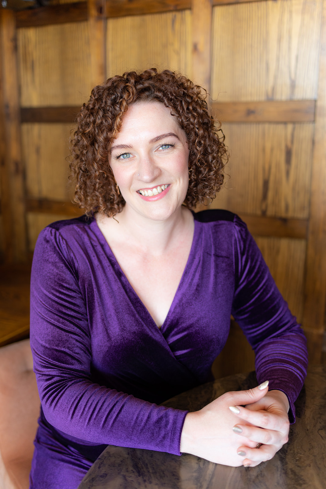 Female personal trainer with curly hair, based in Horsham West Sussex