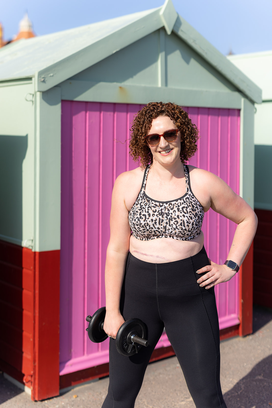 Horsham personal trainer Becky Hughes smiling in gym wear