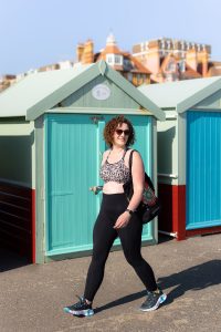 Horsham personal trainer Becky Hughes smiling in gym wear